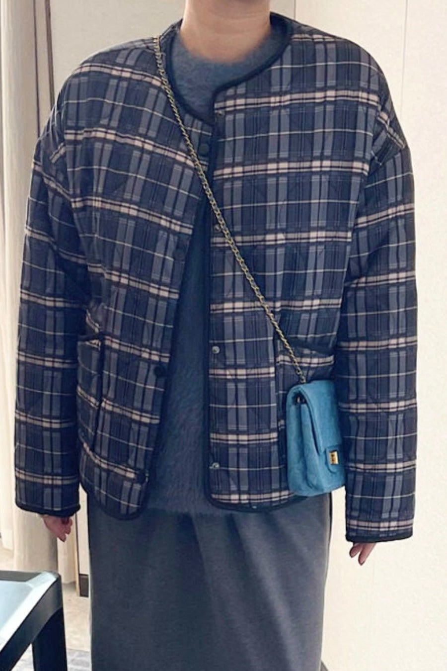 Lässige karierte Steppjacke