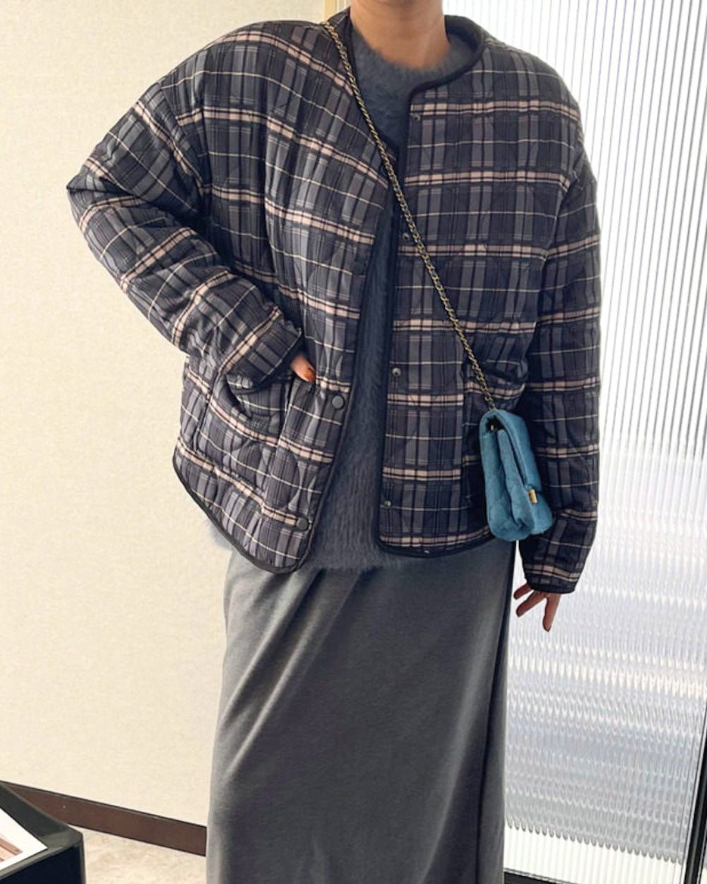 Lässige karierte Steppjacke