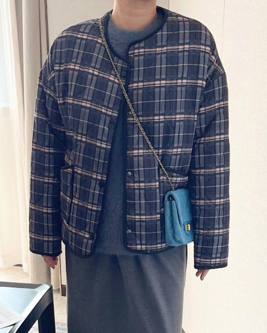 Lässige karierte Steppjacke